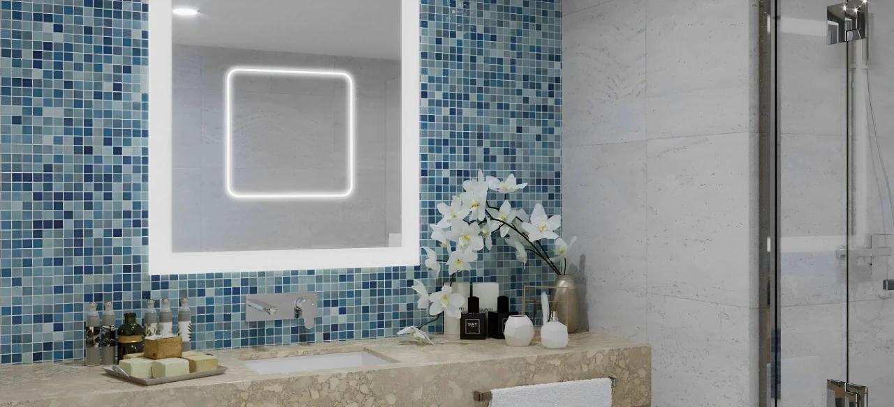 Bathroom featuring a modern sink and a large mirror reflecting the bright, well-lit space in Fujairah.