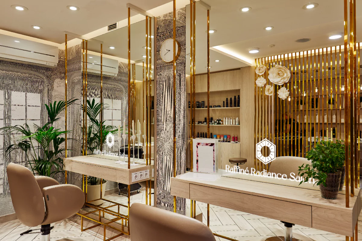 A fancy salon with dazzling led mirrors, a shining name and gold decoration in Fujairah.