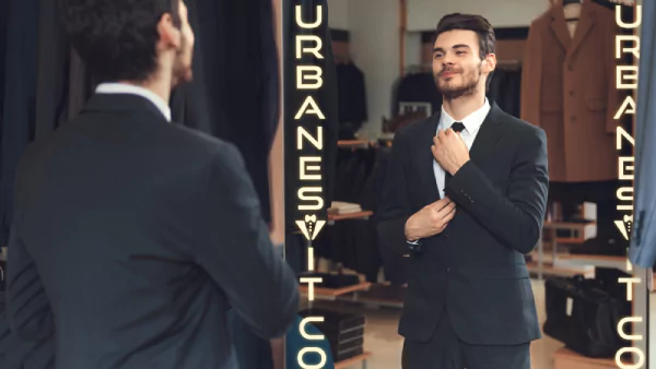 Icon of a man in a suit adjusts his necktie and looks at himself in a led light mirror from Qatar.