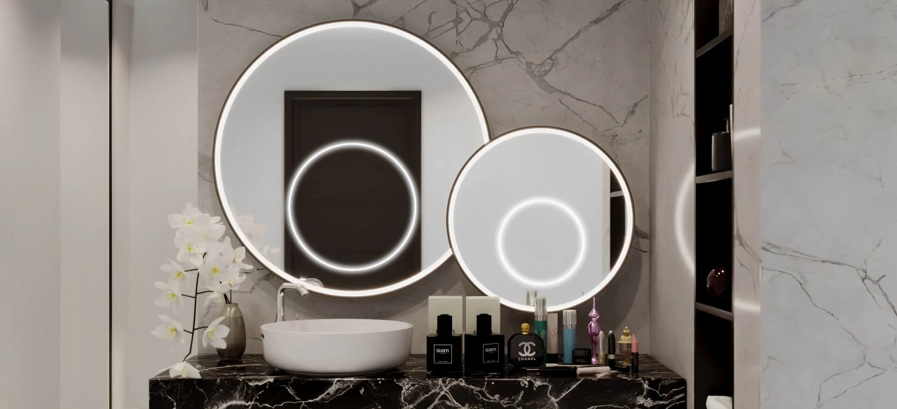 A well-lit bathroom with stylish mirrors and a sink, emphasizing a contemporary aesthetic in Kuwait.