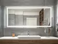 Mini of rectangular evervue lighted mirror set on a concrete wall above a white solid sink in Qatar.