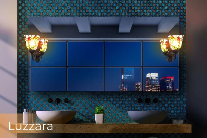 A Luzzara lamp situated within a lighted vanity mirror that is mounted on the wall from Abu Dhabi.