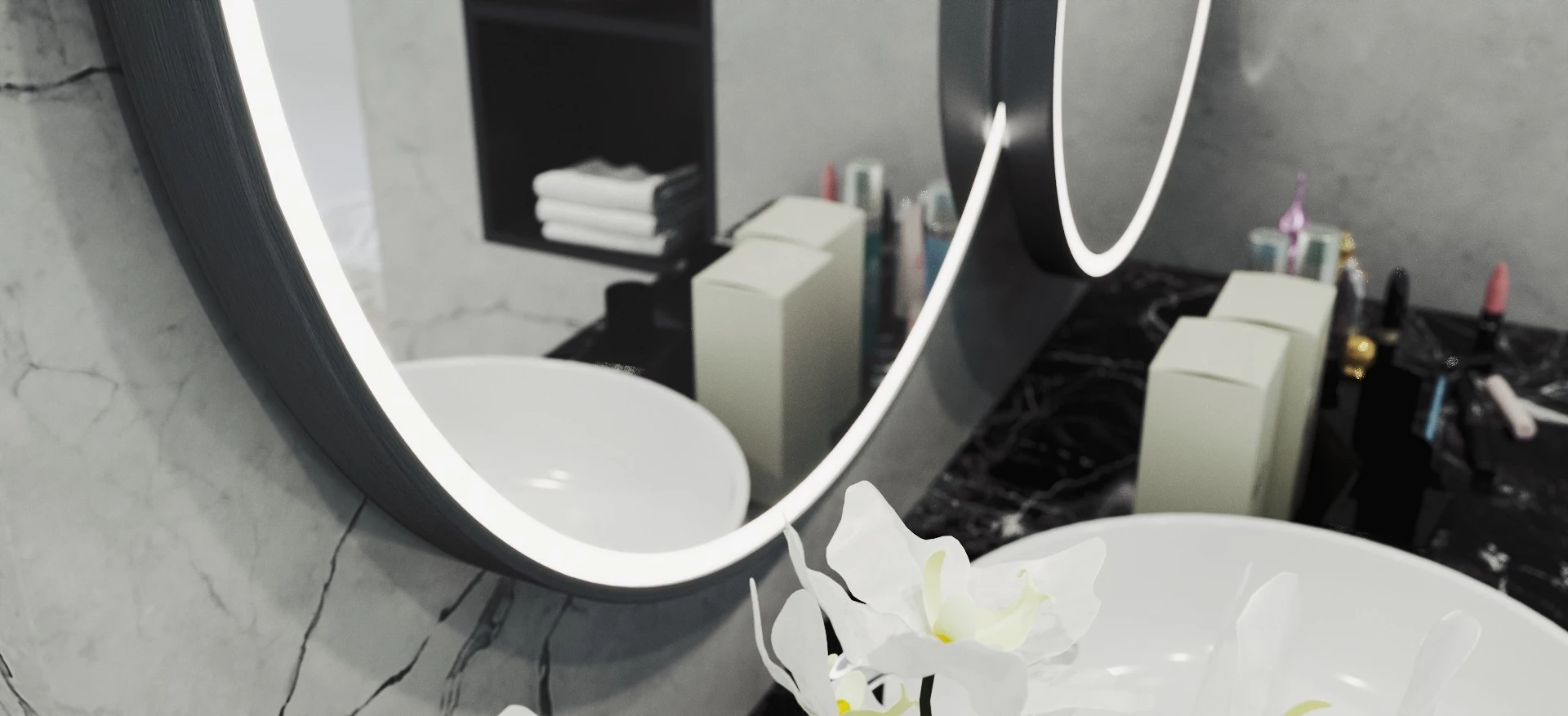 Lighted aluminum framed mirror with white orchid and sink below in Saudi Arabia.