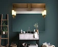 Mini of tachini lamp within a wall mounted vanity mirror and a plant ladder on the side from Dubai.