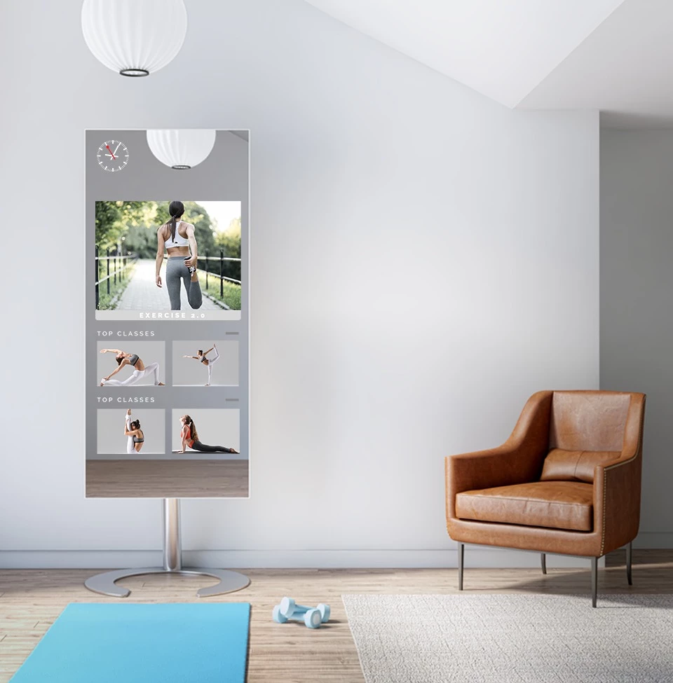 Fitness mirror TV displaying various workout classes in a large room.