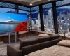 Icon of a cozy bedroom with big screen TV and cityscape.